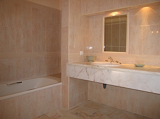 showing the bath in the en-suite